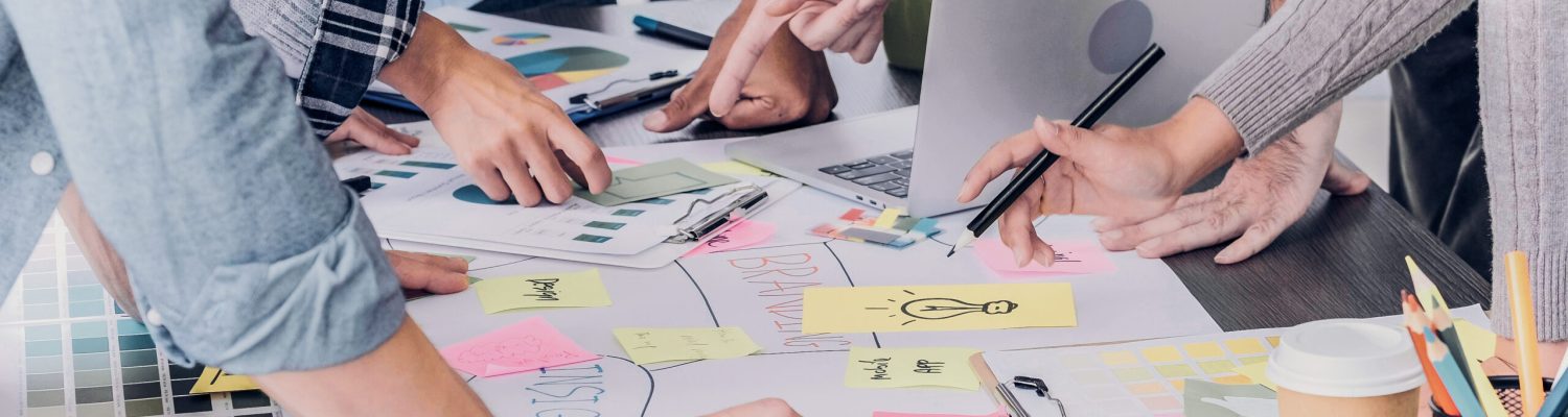 Close up creative designer applaud for job success at meeting table at office